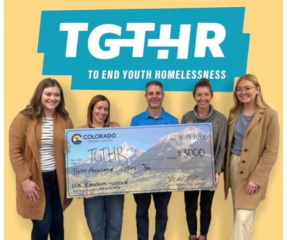 TGTHR to end youth homelessness group photo check donation