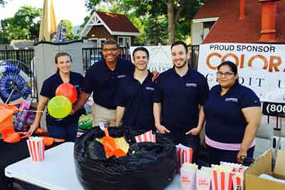 Colorado Credit Union staff smiling while outside working an event.