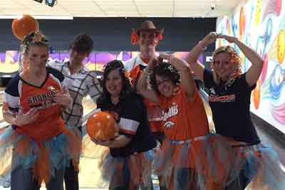 Staff bowling in costumes