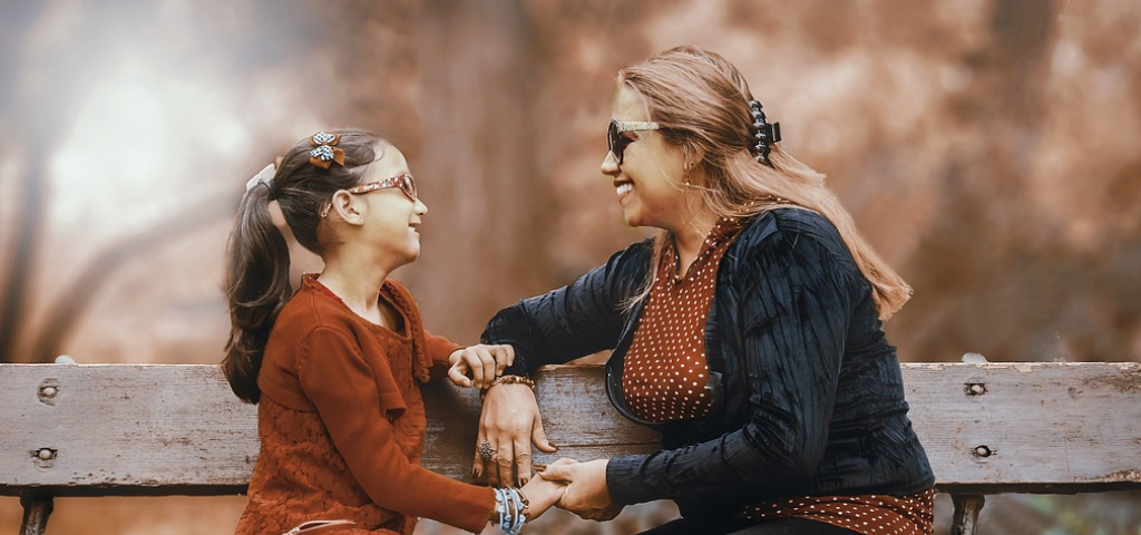 Mother talking to daughter.