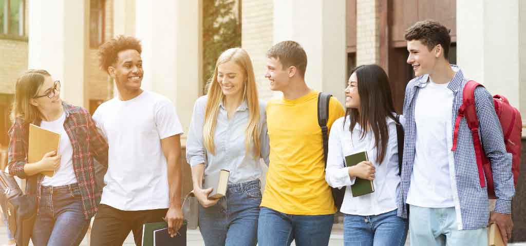 Group of college kids standing in a group.